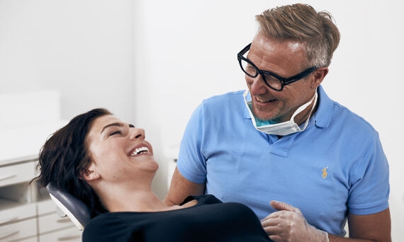 Patient and clinician smiling